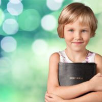 Child holding bible