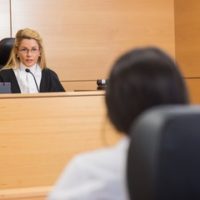 Judge and another person in a courtroom